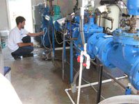 Engineer maintaining machinery in a workshop